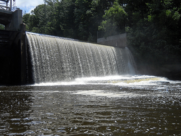 Water flowing over dam