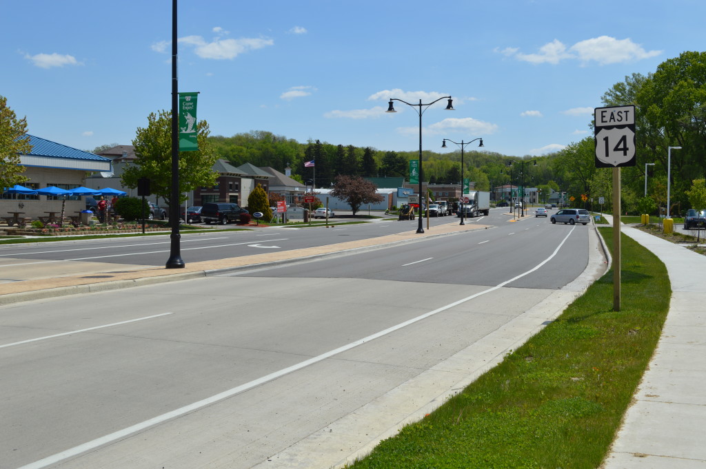 Transition from concrete to asphalt along multi-lane roadway
