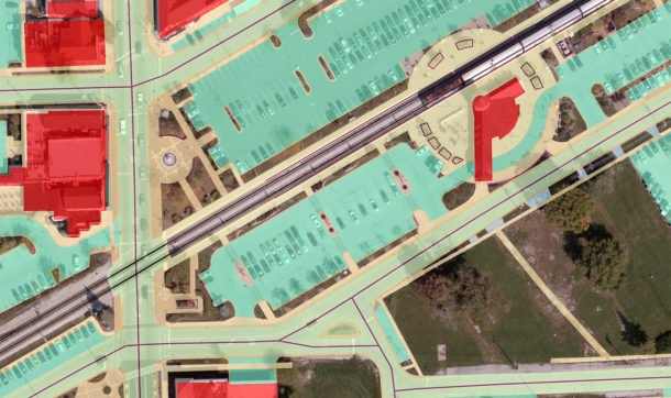 In this example, paved surfaces and buildings are displayed on top of aerial imagery showing impervious surfaces.
