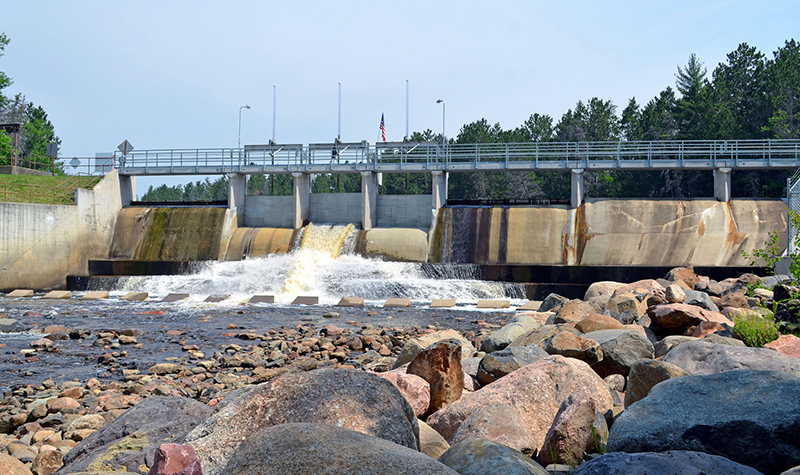 Example of a dam with water flowing over it.