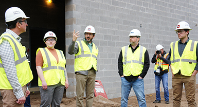 Group standing on the site of the future County Materials Complex