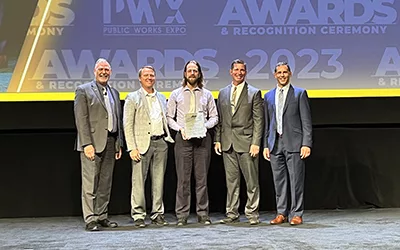 Dan Sydow, PE, Ayres’ manager of structural engineering, second from left, celebrates the award Monday along with representatives of the City of Eau Claire and APWA.