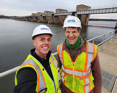 Ayres Employee-owner taking selfie with bridge project.